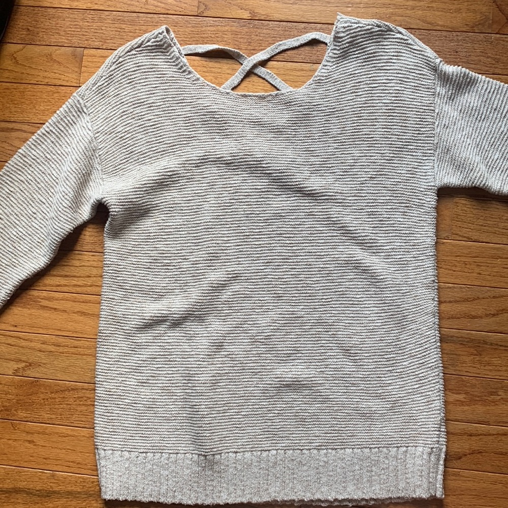 Gently used American Eagle Sweater with an open back with a cross cross pattern